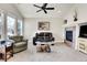 Comfortable living room with vaulted ceilings, fireplace, and ample natural light at 7633 S Addison Way, Aurora, CO 80016