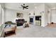 Inviting living room featuring plush seating, a fireplace, and neutral decor at 7633 S Addison Way, Aurora, CO 80016