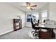 Bright home office featuring a ceiling fan, an office desk and a comfortable chair at 7633 S Addison Way, Aurora, CO 80016