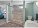 Modern bathroom features tile flooring, a walk-in shower and neutral walls at 4175 S Sidney Ct, Denver, CO 80237