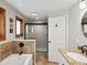Updated bathroom features a soaking tub and glass-enclosed shower at 4175 S Sidney Ct, Denver, CO 80237