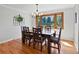 Elegant dining room with hardwood floors, a chandelier, and a large window at 4175 S Sidney Ct, Denver, CO 80237