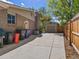 Long driveway leading to a detached garage with a well-maintained yard at 4175 S Sidney Ct, Denver, CO 80237