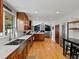 Modern kitchen featuring stainless steel appliances, a cozy eating area, and an open floor plan at 4175 S Sidney Ct, Denver, CO 80237