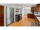 Kitchen with stainless steel appliances, hardwood floors, and a breakfast bar at 4175 S Sidney Ct, Denver, CO 80237