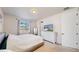 Bright bedroom with a large window offering a view of the neighborhood at 10553 Xenia Ct, Commerce City, CO 80640