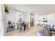 Cozy dining area adjacent to a modern kitchen, filled with natural light at 10553 Xenia Ct, Commerce City, CO 80640