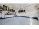 Clean garage with ample shelving and storage for bikes and bins at 10553 Xenia Ct, Commerce City, CO 80640