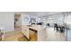 An open-concept kitchen flows seamlessly into the living area, promoting a connected living experience at 10553 Xenia Ct, Commerce City, CO 80640