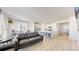 Spacious living area with an open floor plan to the kitchen and dining area at 10553 Xenia Ct, Commerce City, CO 80640