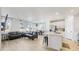 Open living space with ample natural light, flowing into kitchen and dining areas at 10553 Xenia Ct, Commerce City, CO 80640