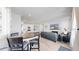A spacious living area integrates an open floor plan with the kitchen and dining areas, perfect for gatherings at 10553 Xenia Ct, Commerce City, CO 80640
