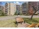 Building exterior showing a landscaped walkway and seating at 13631 E Marina Dr # 502, Aurora, CO 80014