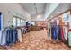 Golf shop interior with clothing racks, accessories, checkout counter, and vaulted ceilings at 13631 E Marina Dr # 502, Aurora, CO 80014