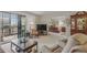 Spacious living room with neutral carpet, plenty of natural light, and a balcony at 13631 E Marina Dr # 502, Aurora, CO 80014