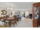 Open floor plan featuring a dining area and a living room with a sliding glass door to the balcony at 13631 E Marina Dr # 502, Aurora, CO 80014