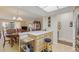 Open living space with dining area, kitchen, and bright natural light at 13631 E Marina Dr # 502, Aurora, CO 80014
