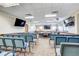 Conference area features rows of seating and large screen monitors at 13631 E Marina Dr # 502, Aurora, CO 80014
