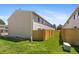 Spacious backyard with a well-maintained lawn and tall wooden privacy fence for outdoor enjoyment at 8915 Field St # 116, Broomfield, CO 80021