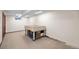 Unfinished basement featuring table for storage at 8915 Field St # 116, Broomfield, CO 80021