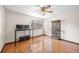Bright bedroom featuring hardwood floors, ceiling fan and natural light at 8915 Field St # 116, Broomfield, CO 80021