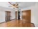 Bright bedroom featuring hardwood floors and closet at 8915 Field St # 116, Broomfield, CO 80021