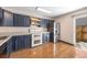 Bright kitchen featuring wood cabinets, stainless steel appliances, and hardwood floors at 8915 Field St # 116, Broomfield, CO 80021