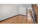 Bright living room with hardwood floors and staircase featuring iron railing to the upper level at 8915 Field St # 116, Broomfield, CO 80021