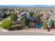 Aerial view of the home featuring a backyard pool, lawn and neighborhood at 10700 Addison Ct, Highlands Ranch, CO 80126