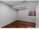Bright bedroom with hardwood floors and a window providing natural light at 10700 Addison Ct, Highlands Ranch, CO 80126