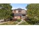 Two-story home with well-maintained landscaping and a welcoming front porch at 10700 Addison Ct, Highlands Ranch, CO 80126