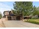 Spacious home with a large driveway and three-car garage at 10700 Addison Ct, Highlands Ranch, CO 80126