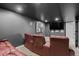 Home theater with plush seating, dark walls, and a large flat screen TV at 10700 Addison Ct, Highlands Ranch, CO 80126