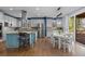 Bright kitchen with ample workspace, modern appliances, and sunny dining area at 10700 Addison Ct, Highlands Ranch, CO 80126