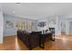 Bright living room with a cozy fireplace, ample natural light, and wood flooring at 10700 Addison Ct, Highlands Ranch, CO 80126