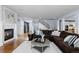 Open-concept living space with fireplace and staircase views at 10700 Addison Ct, Highlands Ranch, CO 80126