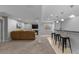 Cozy living room featuring a fireplace, TV, comfortable seating, and a nearby wet bar at 10700 Addison Ct, Highlands Ranch, CO 80126