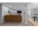 Cozy living room featuring a fireplace, TV, and comfortable seating arrangement, and a nearby wet bar at 10700 Addison Ct, Highlands Ranch, CO 80126