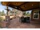 Inviting outdoor patio with a cedar ceiling, complete with a ceiling fan and outdoor seating at 10700 Addison Ct, Highlands Ranch, CO 80126