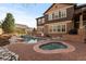 Inviting backyard pool and spa with brick patio at 10700 Addison Ct, Highlands Ranch, CO 80126
