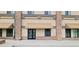 Close up of the building entrance, featuring stone accents, canvas awnings, and a clearly marked suite number at 615 24Th St # 103, Golden, CO 80401