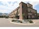 A professional office building with stone and tan facade, well-manicured landscaping, and ample parking at 615 24Th St # 103, Golden, CO 80401