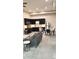 Stylish open floor plan combining living and dining, accented by modern decor, sleek kitchen and bright natural light at 615 24Th St # 103, Golden, CO 80401