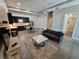 Comfortable living room with a modern kitchen, sleek concrete floors, and stylish furnishings at 615 24Th St # 103, Golden, CO 80401