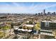 An aerial shot of the buildings with the city skyline in the background at 1601 Park Ave # 202, Denver, CO 80218