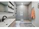 Modern bathroom featuring a sleek shower and vanity, offering a spa-like experience at 1601 Park Ave # 202, Denver, CO 80218
