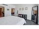 View of a stylish bedroom leading to a full kitchen featuring modern appliances at 1601 Park Ave # 202, Denver, CO 80218