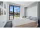 Modern bedroom with a large window and neutral colors at 1601 Park Ave # 202, Denver, CO 80218