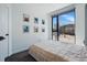 Bedroom featuring large window and view of the street at 1601 Park Ave # 202, Denver, CO 80218