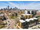 Apartment buildings are spread out in this scenic aerial view showing the skyline in the distance at 1601 Park Ave # 202, Denver, CO 80218